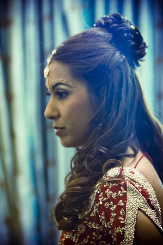 Bride in pink saree with bridal jewelry and soft glam makeup